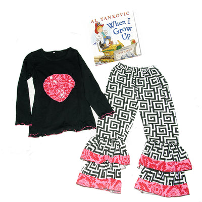 Two piece black and white palazzo bottoms and long sleeve ruffle heart top